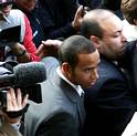 McLaren Formula One driver Lewis Hamilton of Britain arrives at the International Automobile Association (FIA) headquarters in Paris