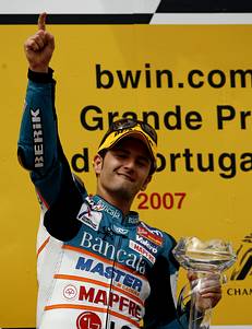 Aprilia's 125 cc rider Faubel celebrates his victory on the podium at the Portuguese Grand Prix at the Estoril track