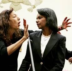 Anti-war protestor jumps up in front of U.S. Secretary of State Rice on Capitol Hill