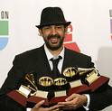 Dominican singer-songwriter Guerra poses with the Latin Grammy awards he won in Las Vegas