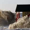 Waves crash into the sea defences at Southwold in Suffolk,eastern England during strong winds, high tides, and tidal surges